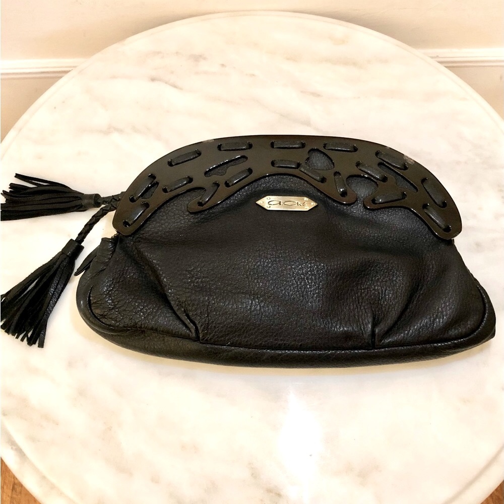 Ornate clutch with leather mix